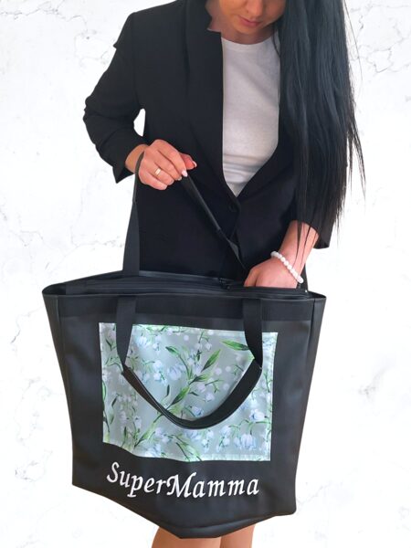 Melna soma ar maijpuķītēm